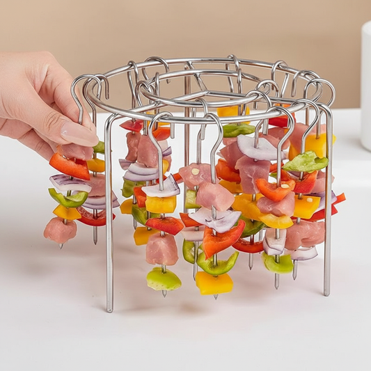 Stainless steel skewer rack with four kebab skewers loaded