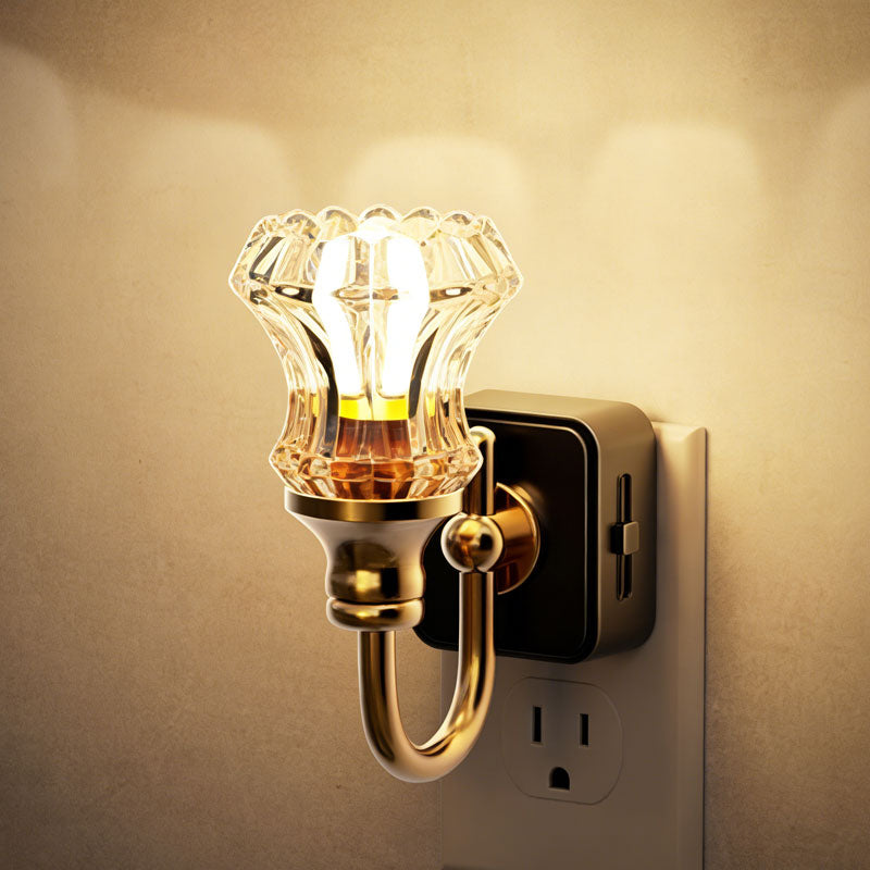 Vintage wall sconce with crystal-style shade plugged into an outlet