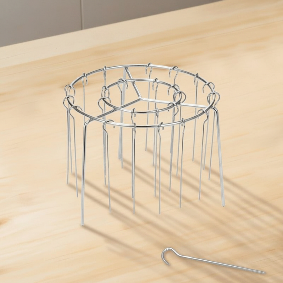 Skewer rack with kebabs placed inside an air fryer basket