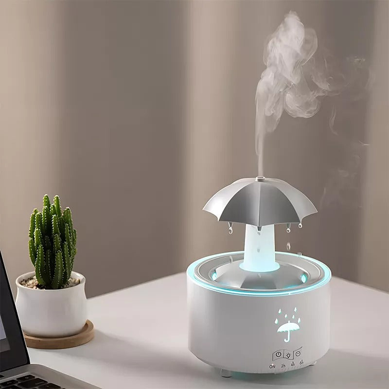 White humidifier on a desk next to a cactus