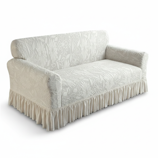 Beige jacquard sofa slipcover with ruffled skirt on white background