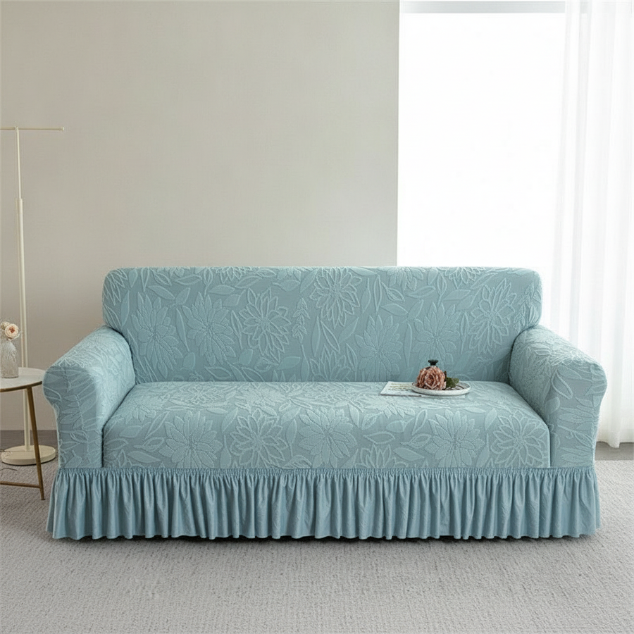 Light blue jacquard sofa slipcover in bright modern living room