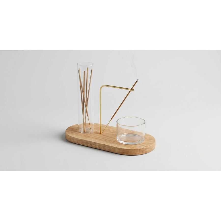 Incense holder set at three-quarter angle on light gray background