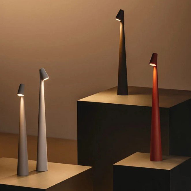 Minimalist LED table lamp casting warm light