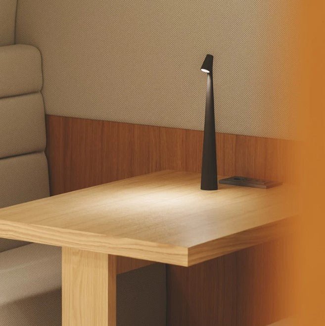 Minimalist LED table lamp turned on