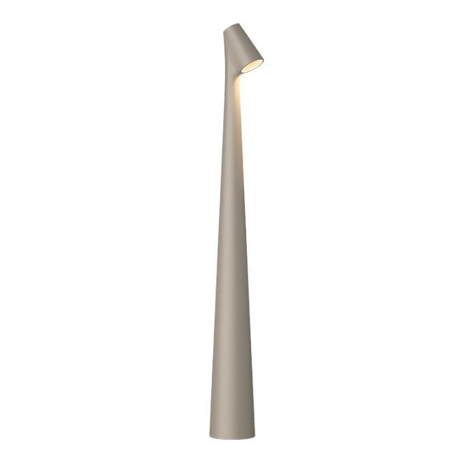 Minimalist LED table lamp glowing in a dim room