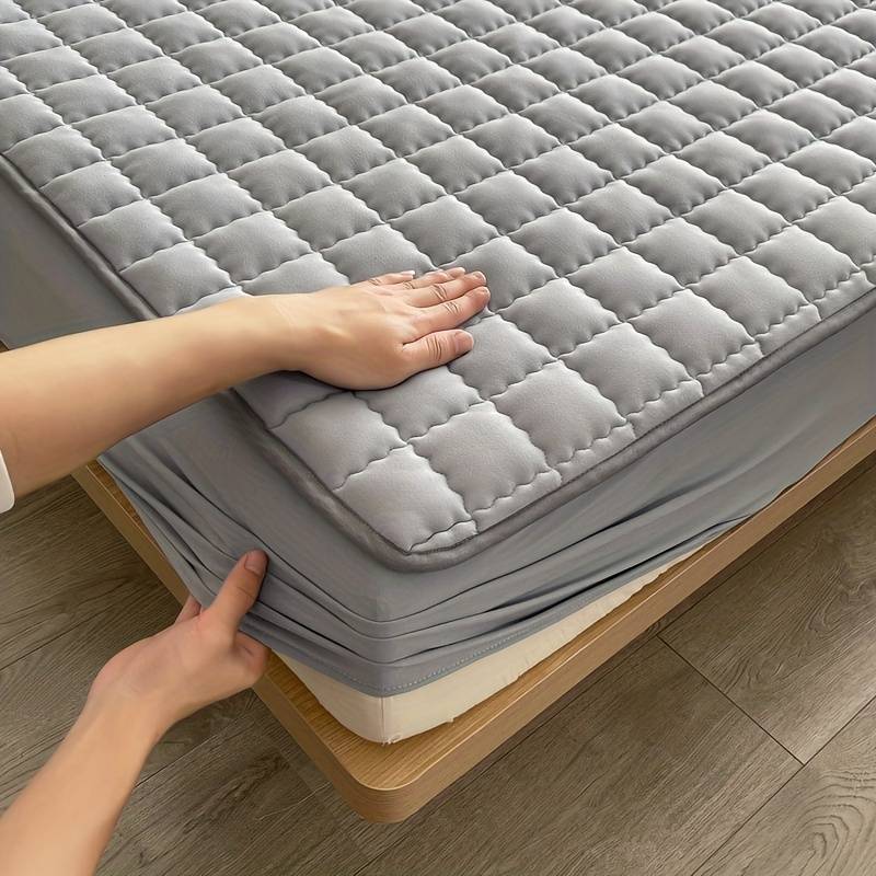 Detail shot of the quilted mattress cover stitching
