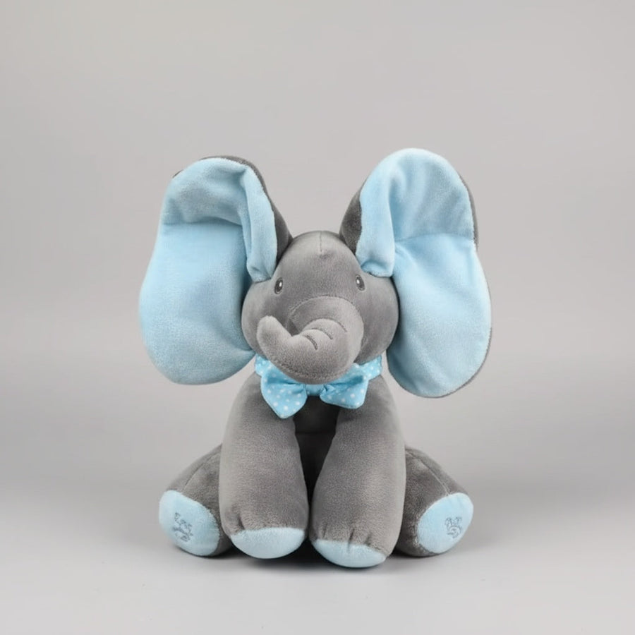 Blue peek-a-boo elephant plush sitting with ears up