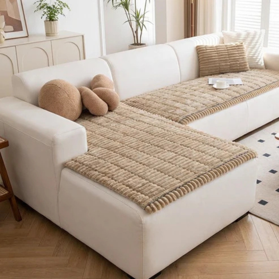 Gray quilted sofa cushion styled with pillows