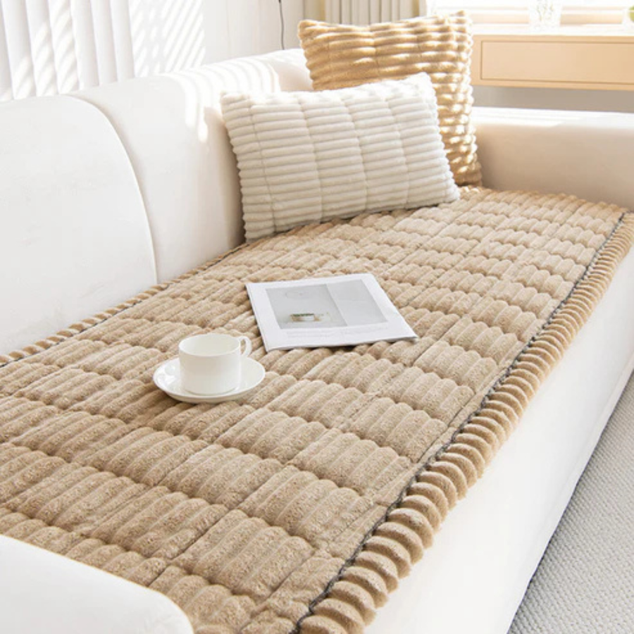 Green quilted cushion accenting a living room sofa