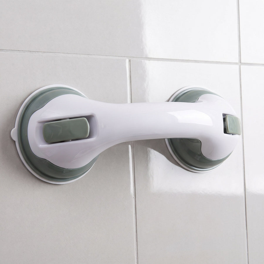 Safety handle with suction cups mounted on a tiled wall