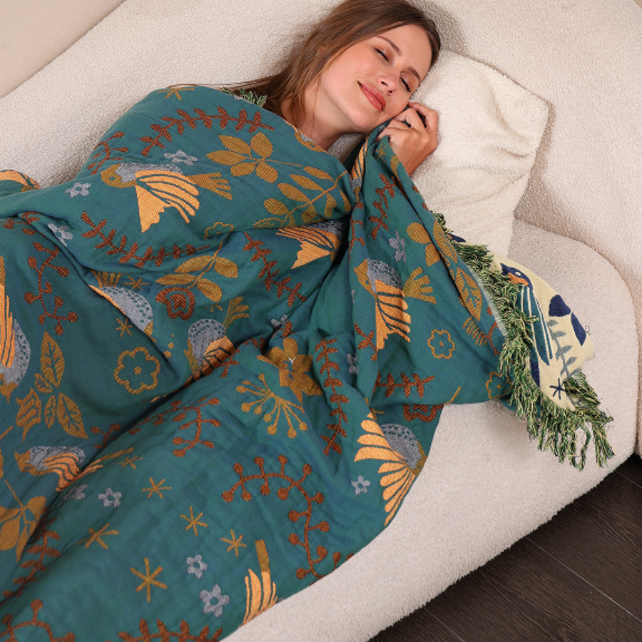 Bird throw blanket styled in a living room setting