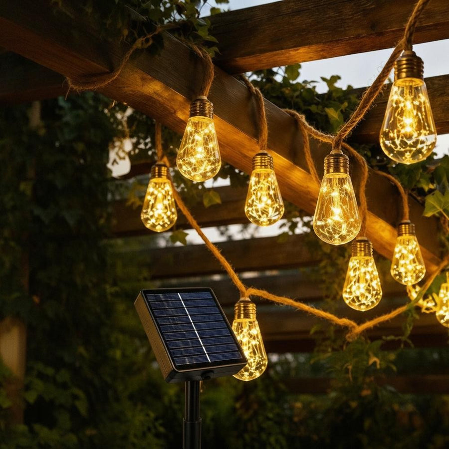 Solar hemp rope string lights on a pergola with warm white LEDs and visible solar panel