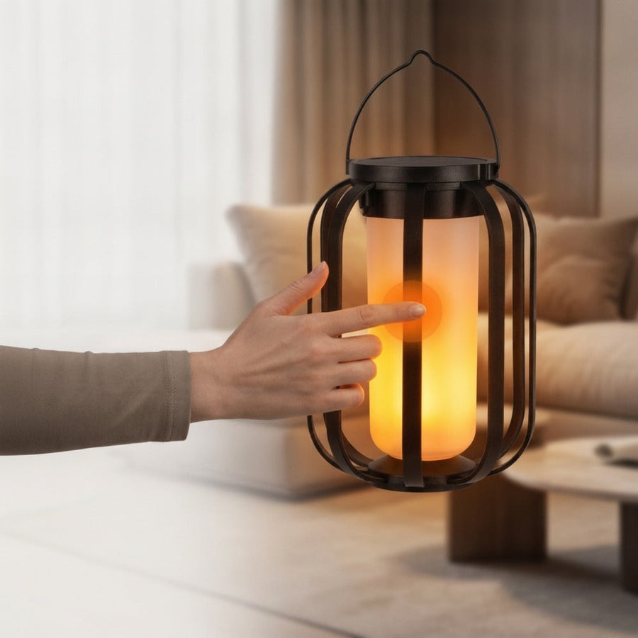 Hand holding the solar lantern to show its cool-to-the-touch surface