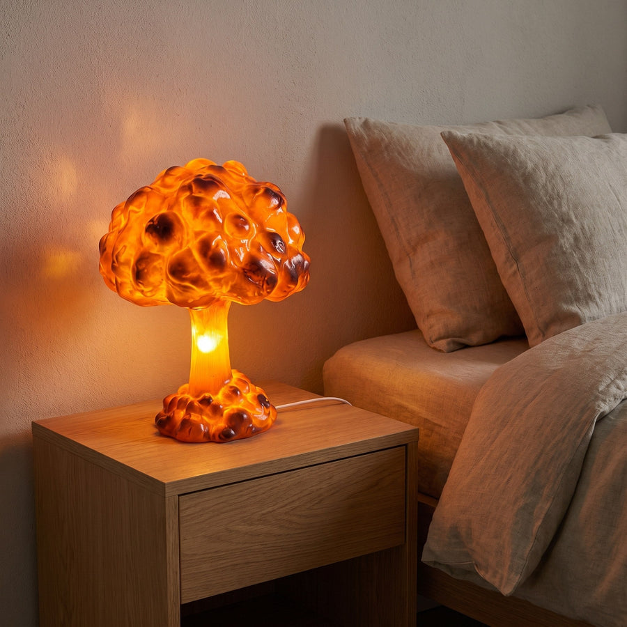 The mushroom cloud lamp on a nightstand in a bedroom