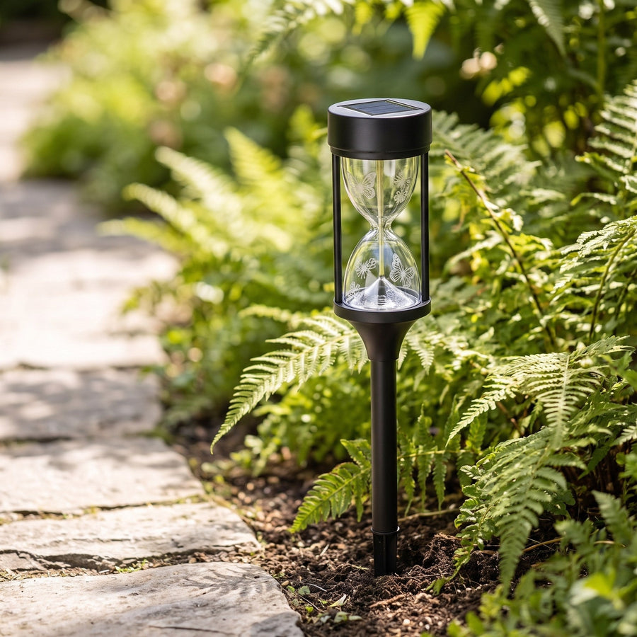 Hourglass light in daylight showing the solar panel on top