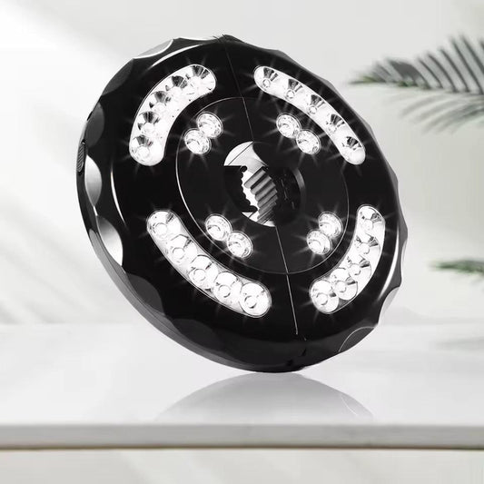 Black umbrella pole light with 28 LEDs arranged in a ring