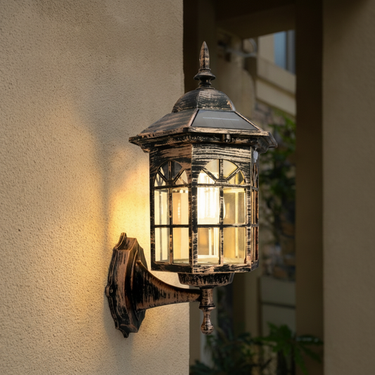 Solar-powered wall lantern with motion sensor mounted on house wall during daytime