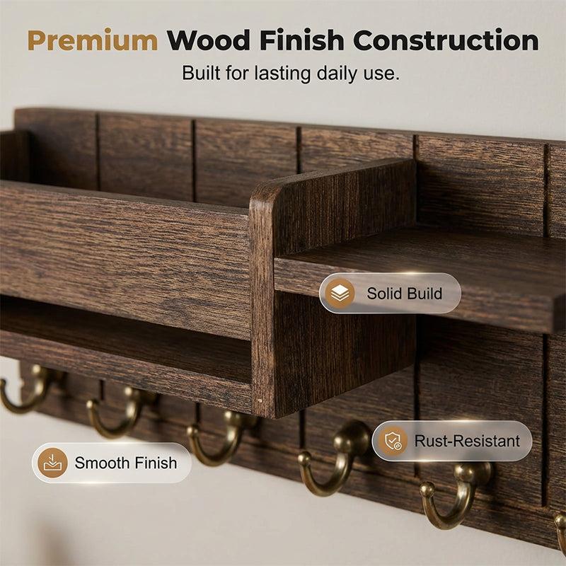 Close-up of wood grain finish and brass key hooks